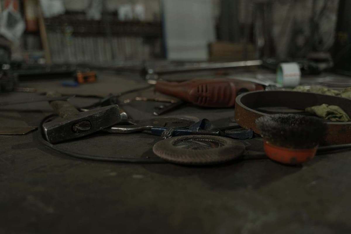 Hand tools scattered across a workbench surface
